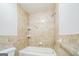 Bathroom featuring tiled walls, a shower head, and a sleek, clean design at 3260 Russell St, Hapeville, GA 30354