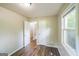 Bedroom with neutral walls and hardwood flooring, illuminated by natural light at 3260 Russell St, Hapeville, GA 30354