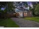 Charming brick home with a driveway, a covered porch, and well-maintained landscaping at 3260 Russell St, Hapeville, GA 30354