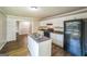 Well-lit kitchen with white cabinets, stainless steel appliances, and island at 3260 Russell St, Hapeville, GA 30354