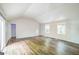 Spacious living room with wood floors, vaulted ceiling, and natural light at 3260 Russell St, Hapeville, GA 30354