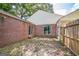 Brick patio outside a brick home with a white roof, offering an outdoor space for relaxation at 3260 Russell St, Hapeville, GA 30354