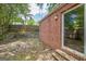 Brick patio featuring an adjacent brick wall with a sliding glass door to allow outside enjoyment at 3260 Russell St, Hapeville, GA 30354