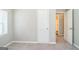 This bedroom has neutral carpet and paint with an ensuite bathroom at 1381 Sharon Sw St, Atlanta, GA 30314