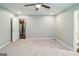 Spacious bedroom with a ceiling fan and a view into another room at 1381 Sharon Sw St, Atlanta, GA 30314