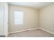 This empty bedroom has neutral paint and carpet and a window for light at 1381 Sharon Sw St, Atlanta, GA 30314