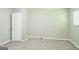 Bright bedroom offering neutral decor, comfortable carpet, and a large closet for storage at 1381 Sharon Sw St, Atlanta, GA 30314