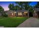 Charming brick home with a well-manicured lawn and a cozy front porch at 1381 Sharon Sw St, Atlanta, GA 30314