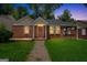 Charming brick home featuring a well-manicured lawn and inviting front porch area at 1381 Sharon Sw St, Atlanta, GA 30314