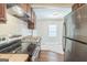Modern kitchen featuring stainless steel appliances and seamlessly flowing into the dining area at 1381 Sharon Sw St, Atlanta, GA 30314