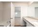 Modern bathroom with granite countertops and a view into the bright bedroom at 244 Oliver Dr, Locust Grove, GA 30248