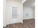 Bright entryway showcasing a white door with blinds and hardwood floors at 244 Oliver Dr, Locust Grove, GA 30248