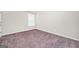 This bedroom has neutral walls, carpet, one window, and electrical outlets at 9046 Holder Rd, Locust Grove, GA 30248