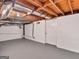 Basement with concrete floor and painted block walls with utilities showing at 100 Homestead Pl, Rex, GA 30273