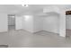 This is a large basement with concrete floors and white painted walls at 100 Homestead Pl, Rex, GA 30273