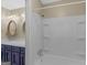Clean bathroom featuring a white shower/tub combo and blue vanity with double sinks at 100 Homestead Pl, Rex, GA 30273