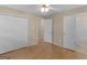 Spacious bedroom featuring hardwood floors, closet space, and a ceiling fan for comfort at 100 Homestead Pl, Rex, GA 30273