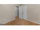 Bedroom with hardwood floors, neutral walls, and closet doors, offering a clean and functional space at 100 Homestead Pl, Rex, GA 30273