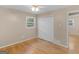 Cozy bedroom featuring hardwood floors, a window for natural light, and ample closet space at 100 Homestead Pl, Rex, GA 30273