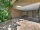 View of the home's attached carport with space for vehicles and access to the house at 100 Homestead Pl, Rex, GA 30273