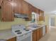Well-lit kitchen featuring updated appliances and neutral countertops at 100 Homestead Pl, Rex, GA 30273