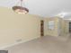 Spacious living area with backyard access, perfect for indoor-outdoor living at 100 Homestead Pl, Rex, GA 30273