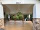An exterior pavilion with a ceiling fan and stone pillars at 9108 Alden Dr, Locust Grove, GA 30248