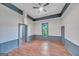 Spacious bedroom with hardwood floors, neutral paint, and abundant natural light at 1128 Milstead Ne Ave, Conyers, GA 30012