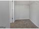 Walk-in closet offering ample storage space with neutral carpeting at 122 Meadowview Dr # 11, Temple, GA 30179