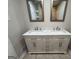 This updated bathroom features a double vanity with a marble countertop at 421 Safari Cir, Stone Mountain, GA 30083