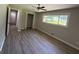 Comfortable bedroom featuring wood-look flooring, neutral walls, and a ceiling fan for added comfort at 421 Safari Cir, Stone Mountain, GA 30083