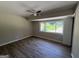 A bright bedroom offers a ceiling fan and large window at 421 Safari Cir, Stone Mountain, GA 30083