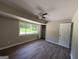Bedroom featuring a ceiling fan and large window with natural light at 421 Safari Cir, Stone Mountain, GA 30083