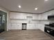 Modern kitchen featuring stainless steel appliances, white cabinetry, granite countertops, and a subway tile backsplash at 421 Safari Cir, Stone Mountain, GA 30083