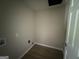 This laundry room has light walls and vinyl flooring at 421 Safari Cir, Stone Mountain, GA 30083