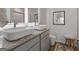 Modern bathroom featuring double sinks, granite countertop, and a sleek, contemporary design at 123 Meadowview Dr # 15, Temple, GA 30179