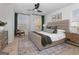 Spacious bedroom featuring a ceiling fan, natural light, and a cozy bed at 123 Meadowview Dr # 15, Temple, GA 30179