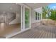 View from back porch through sliding glass door into a spacious, bright living room at 7530 W Homer Dr, Cumming, GA 30028