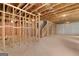 Unfinished basement with exposed beams and framing ready for customization at 7530 W Homer Dr, Cumming, GA 30028