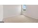 Cozy bedroom with neutral carpet and a window offering natural light at 7530 W Homer Dr, Cumming, GA 30028