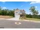 Charming two-story home with a 2-car garage, showcasing a mix of gray siding and brick accents at 7530 W Homer Dr, Cumming, GA 30028