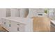 Spacious kitchen with a large island, stainless steel appliances, and open access to the living area at 7530 W Homer Dr, Cumming, GA 30028
