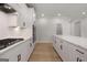 Modern kitchen with stainless steel appliances, gas stove, and ample counter space for cooking at 7530 W Homer Dr, Cumming, GA 30028