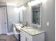 Bathroom featuring double vanity with marble countertops and a large mirror at 910 Lilac Arbor Rd, Dacula, GA 30019