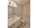 Modern bathroom featuring a white vanity, large mirror, shower and tub at 910 Lilac Arbor Rd, Dacula, GA 30019