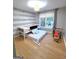 Cozy bedroom with a fun car decal, large window, and pull out bed at 910 Lilac Arbor Rd, Dacula, GA 30019