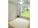 Bright bedroom with large windows offering a view of the outdoor play area at 910 Lilac Arbor Rd, Dacula, GA 30019