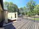 Backyard deck with covered day bed overlooking the backyard at 910 Lilac Arbor Rd, Dacula, GA 30019