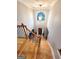Elegant foyer with hardwood floors, high ceilings, and a large arched window at 910 Lilac Arbor Rd, Dacula, GA 30019