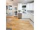 Bright kitchen with stainless steel appliances, white cabinets, and views to the backyard at 910 Lilac Arbor Rd, Dacula, GA 30019